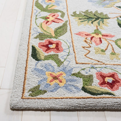 SAFAVIEH Handmade Chelsea Yauhenia French Country Floral Wool Rug