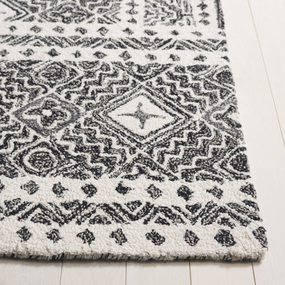 SAFAVIEH Handmade Micro-Loop Lutetia Wool Rug
